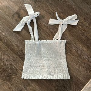 White smocked crop top with adjustable sleeve ties